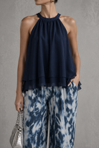 Olimpia | Elegante conjunto con top sin mangas y pantalones anchos estampados